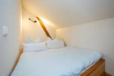 Ein Bett oder Betten in einem Zimmer der Unterkunft Hafen Zwei