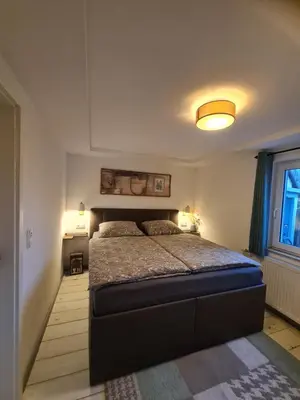Ein Bett oder Betten in einem Zimmer der Unterkunft Möwenstübchen