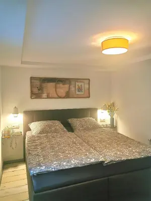 Ein Bett oder Betten in einem Zimmer der Unterkunft Möwenstübchen