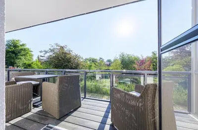 Ein Balkon oder eine Terrasse in der Unterkunft Achterndieck - Modernes 5-Sterne Erdgeschoss-Apartment mit Balkon