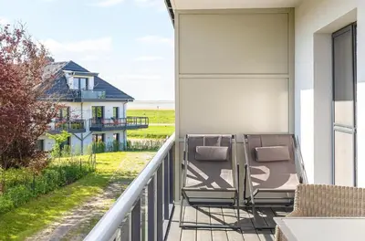Ein Balkon oder eine Terrasse in der Unterkunft Achterndieck - Modernes 5-Sterne Erdgeschoss-Apartment mit Balkon