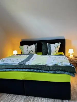 Ein Bett oder Betten in einem Zimmer der Unterkunft Charlys grode Stuv
