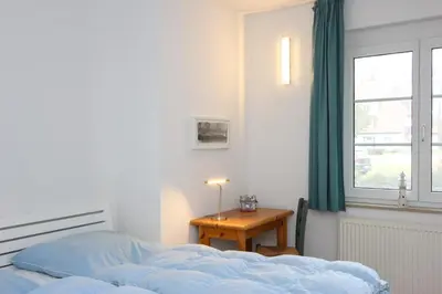 Ein Bett oder Betten in einem Zimmer der Unterkunft Kormoran Brandung