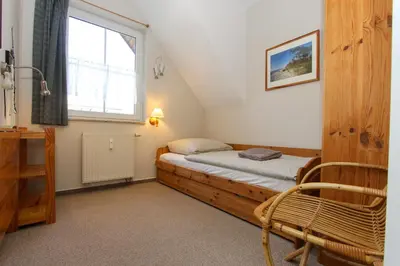 Ein Bett oder Betten in einem Zimmer der Unterkunft Segelzeit