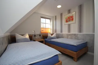 Ein Bett oder Betten in einem Zimmer der Unterkunft Haus Alex Obergeschoss