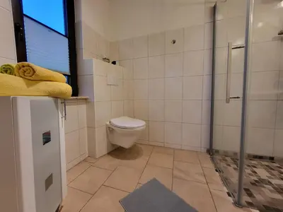 Ein Badezimmer in der Unterkunft Am Norderfeld EG