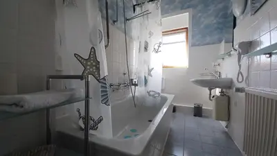 Ein Badezimmer in der Unterkunft Appartement Ostseemuschel