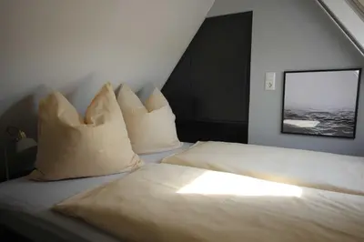 Ein Bett oder Betten in einem Zimmer der Unterkunft Ferienhof Darsser Ort