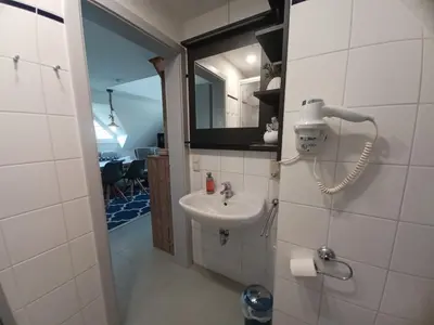 Ein Badezimmer in der Unterkunft Ferienhof Darsser Ort