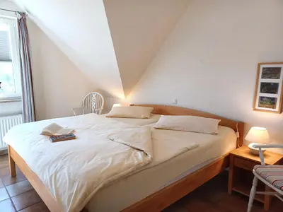Ein Bett oder Betten in einem Zimmer der Unterkunft An den Boddenwiesen I