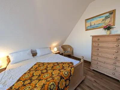 Ein Bett oder Betten in einem Zimmer der Unterkunft Strandperle Buchenhof 5 D