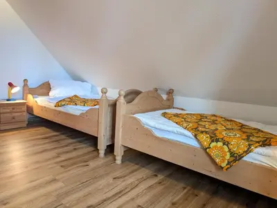 Ein Bett oder Betten in einem Zimmer der Unterkunft Strandperle Buchenhof 5 D