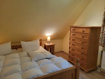 Ein Bett oder Betten in einem Zimmer der Unterkunft Strandperlen Weidenhof 8 A