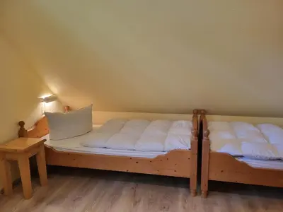 Ein Bett oder Betten in einem Zimmer der Unterkunft Strandperlen Weidenhof 8 A