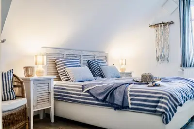 Ein Bett oder Betten in einem Zimmer der Unterkunft Ostseeblau