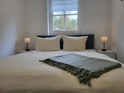 Ein Bett oder Betten in einem Zimmer der Unterkunft Ferienhof am Fischland Flügge