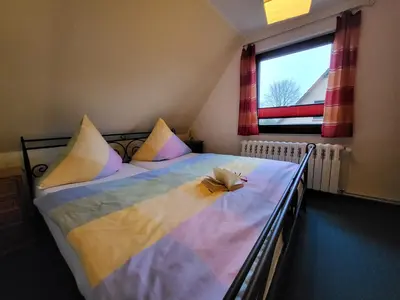 Ein Bett oder Betten in einem Zimmer der Unterkunft Am Norderfeld