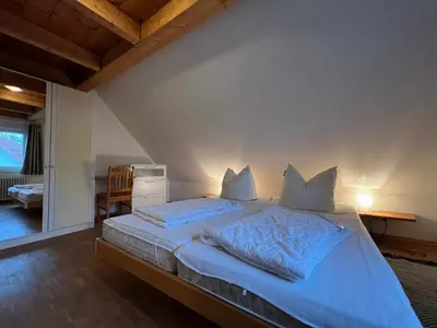 Ein Bett oder Betten in einem Zimmer der Unterkunft Viermaster