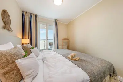 Ein Bett oder Betten in einem Zimmer der Unterkunft Aparthotel 