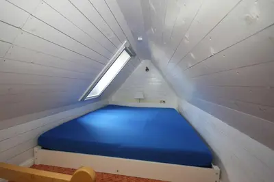 Ein Bett oder Betten in einem Zimmer der Unterkunft Möwennest