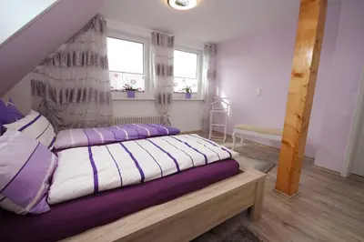 Ein Bett oder Betten in einem Zimmer der Unterkunft Möwennest
