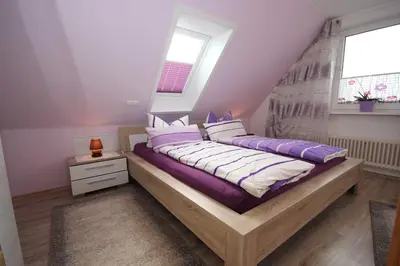 Ein Bett oder Betten in einem Zimmer der Unterkunft Möwennest