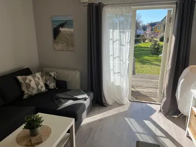 Ein Sitzbereich in der Unterkunft FeWo Ariosa - 4 Personen, Terrasse, Sauna, Garten