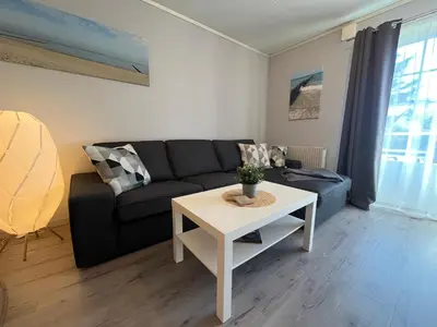 Ein Sitzbereich in der Unterkunft FeWo Ariosa - 4 Personen, Terrasse, Sauna, Garten
