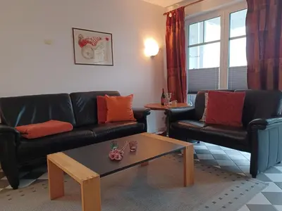 Ein Sitzbereich in der Unterkunft Haus zum Strand 2 4