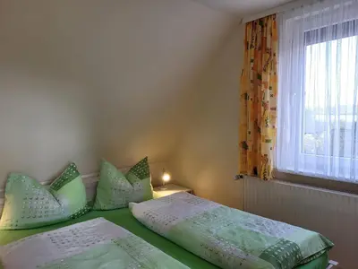 Ein Bett oder Betten in einem Zimmer der Unterkunft Am Küstenwald