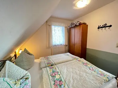 Ein Bett oder Betten in einem Zimmer der Unterkunft Buhne IV OG