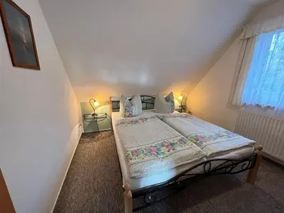 Ein Bett oder Betten in einem Zimmer der Unterkunft Buhne IV OG