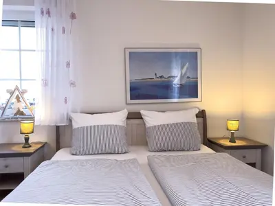 Ein Bett oder Betten in einem Zimmer der Unterkunft Inselperle Whg 1