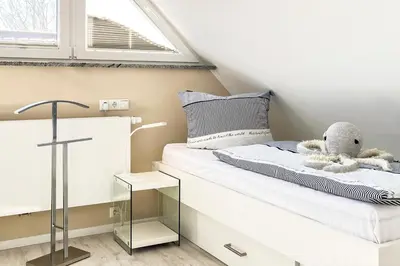 Ein Bett oder Betten in einem Zimmer der Unterkunft Sonnenglebbe 38a
