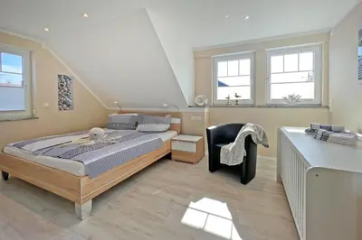 Ein Bett oder Betten in einem Zimmer der Unterkunft Sonnenglebbe 38a