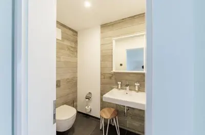 Ein Badezimmer in der Unterkunft Moderne 5-Sterne-Ferienwohnung 