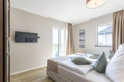 Ein Bett oder Betten in einem Zimmer der Unterkunft 5 Sterne Ferienwohnung Seezeit