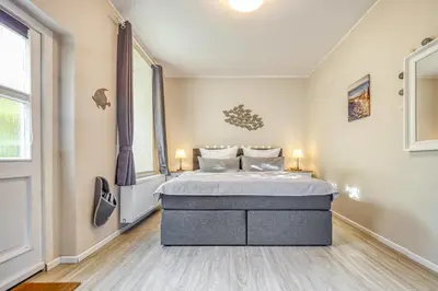 Ein Bett oder Betten in einem Zimmer der Unterkunft Villa Mare Whg 5