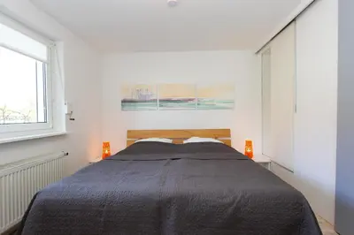 Ein Bett oder Betten in einem Zimmer der Unterkunft Gartendiele