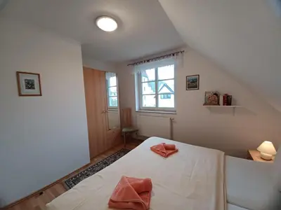 Ein Bett oder Betten in einem Zimmer der Unterkunft Am Meer Backbord