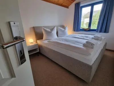 Ein Bett oder Betten in einem Zimmer der Unterkunft Ferienhaus Kurs Nordost