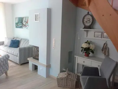 Ein Sitzbereich in der Unterkunft Haus am Meer, romantische 5-Sterne Doppelhaushälfte für 4 Personen in Zingst