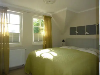 Ein Bett oder Betten in einem Zimmer der Unterkunft Lilienthal, exclusive Doppelhaushälfte für 6 Personen in Zingst