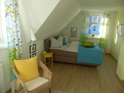 Ein Bett oder Betten in einem Zimmer der Unterkunft Godehus 6, exquisites Ferienhaus für 6 Personen in Zingst