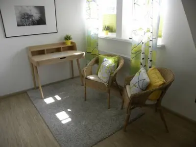 Ein Sitzbereich in der Unterkunft Godehus 6, exquisites Ferienhaus für 6 Personen in Zingst