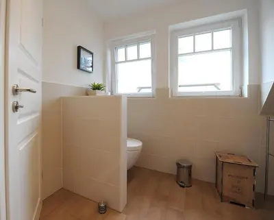 Ein Badezimmer in der Unterkunft Godehus 4, exquisite Ferienwohnung für 4 Personen in Zingst