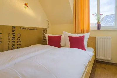 Ein Bett oder Betten in einem Zimmer der Unterkunft Strandperle Whg 20