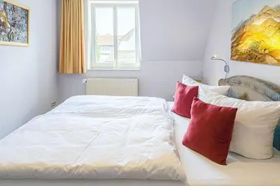 Ein Bett oder Betten in einem Zimmer der Unterkunft Strandperle Whg 20