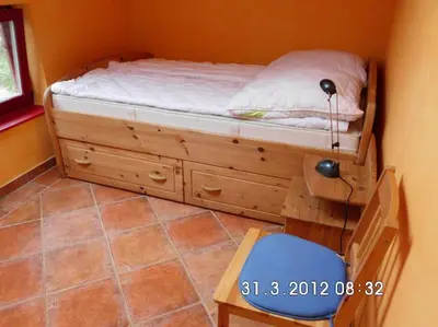 Ein Bett oder Betten in einem Zimmer der Unterkunft Erholung in der Natur - Urlaub im Alten Forsthaus