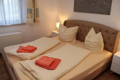 Ein Bett oder Betten in einem Zimmer der Unterkunft Am Deich Strandhaus EG